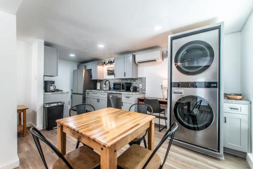 a kitchen with a table and a washer and dryer at Serenity Suites C in Corpus Christi