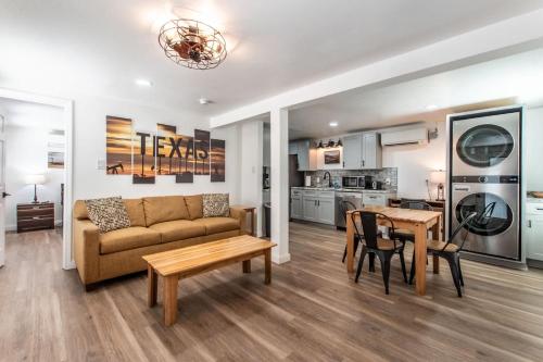 a living room with a couch and a table at Serenity Suites C in Corpus Christi