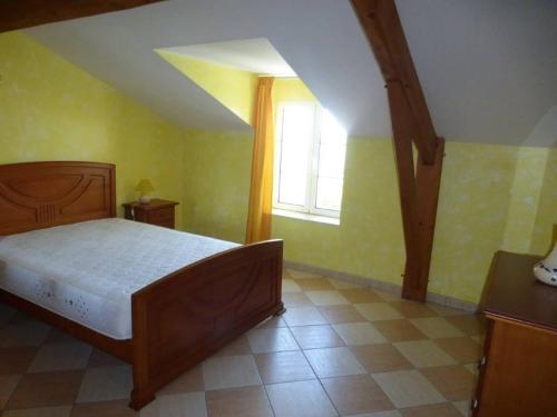 a bedroom with a bed and a window at House in Monségur with Panoramic Views in Monségur