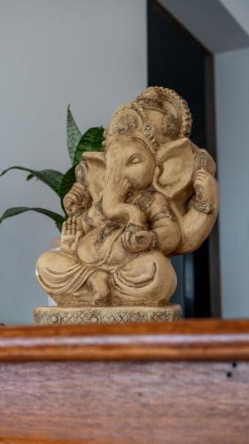 a stone statue sitting on top of a table at Altair Hotel in San Clemente del Tuyú