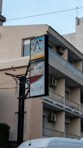 a building with a sign for a art hotel at Altair Hotel in San Clemente del Tuyú