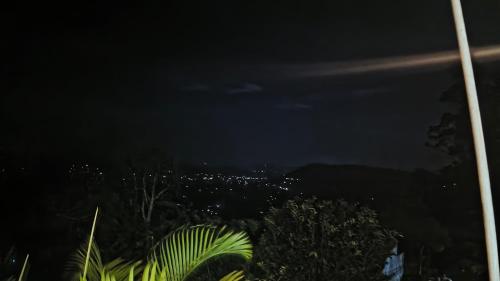 a view of a city at night at Adisham village home in Haputale