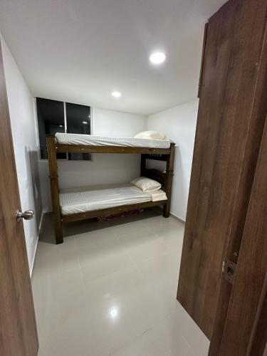 Postel nebo postele na pokoji v ubytování Cozy apartment in the heart of Barranquilla