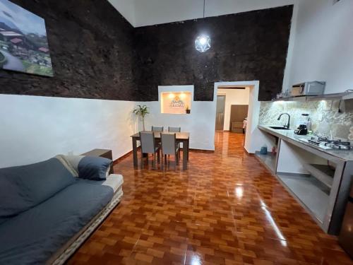a living room with a couch and a table at El Rincón de Tita Teleférico in Orizaba