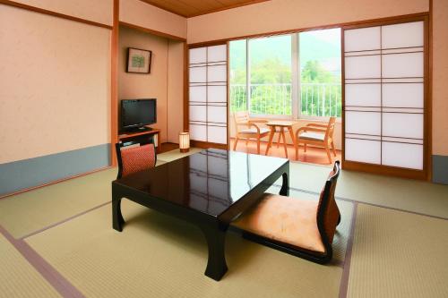 a rendering of a living room with a table and chairs at Arima Kirari in Kobe