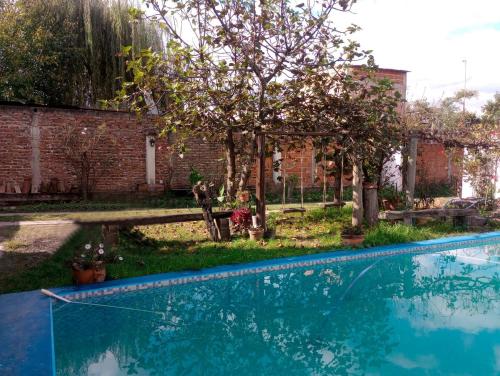 a swimming pool in the yard of a house at Casa Lago in La Silleta