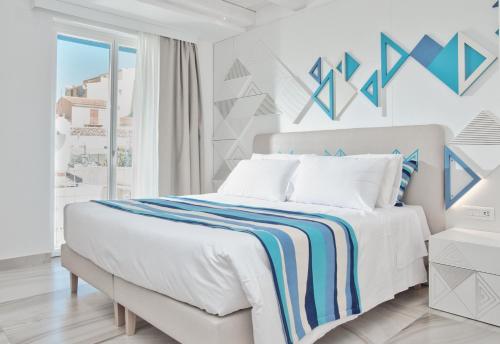 Una cama o camas en una habitación de Luma Relais de Charme