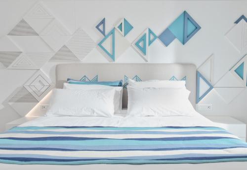 Una cama o camas en una habitación de Luma Relais de Charme