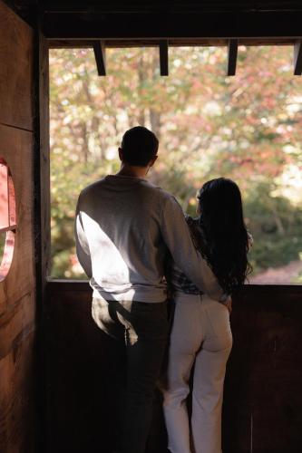 a man and a woman looking out of a window at Dennarque Estate in Mount Wilson