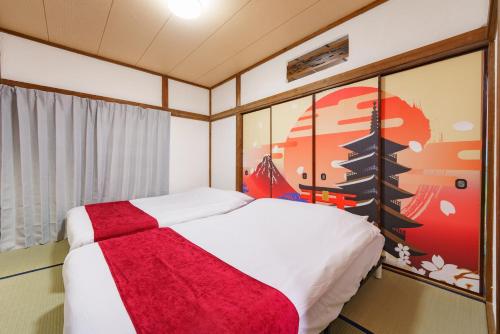 Postel nebo postele na pokoji v ubytování 成田空港直通,駅徒歩11分,浅草直通,58平米,最大10名,和風貸切,日本文化体験,桜,花見,浮世絵