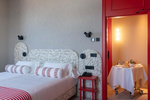 Кровать или кровати в номере Hotel Boutique Faro Silleiro