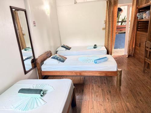 Una cama o camas en una habitación de Happy Destination Auberge