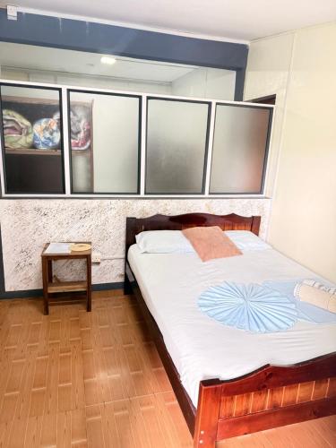Una cama o camas en una habitación de Happy Destination Auberge
