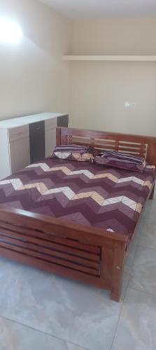 Postel nebo postele na pokoji v ubytování Jayanthi home stay