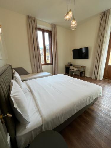 Postel nebo postele na pokoji v ubytování Hotel Duca D'Aosta