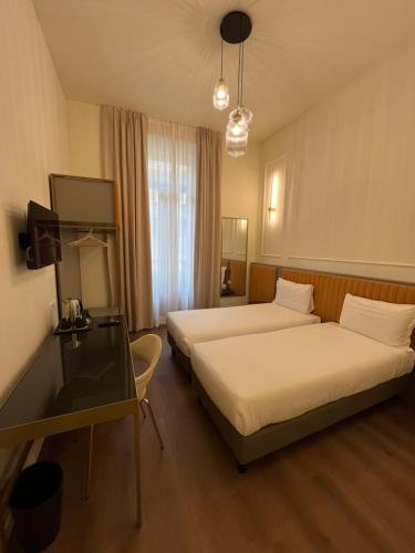 Postel nebo postele na pokoji v ubytování Hotel Duca D'Aosta