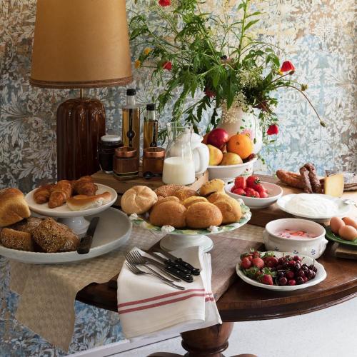 a table with plates of pastries and other foods at Equilibrium Villa Relais in Rakovica