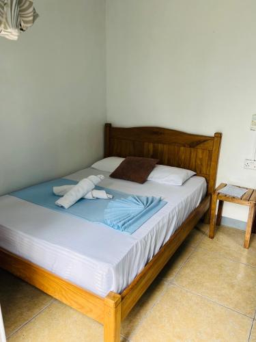 Una cama o camas en una habitación de Happy Destination Auberge