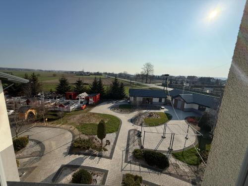 an overhead view of a courtyard with a park at Mąka i Magia - Kuchnia regionalna - Agroturystyka in Zambrów