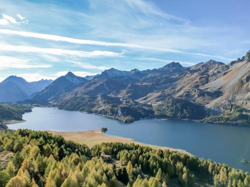 a view of a lake in the mountains at Hotel Chesa Pool in Sils Maria