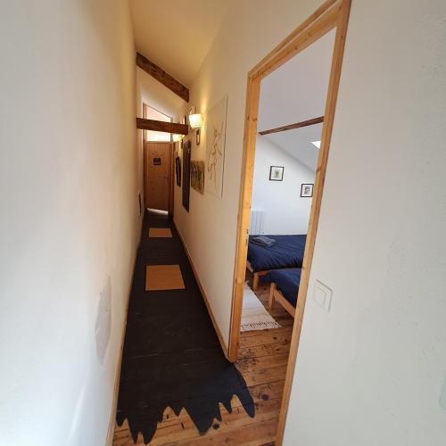 a hallway with a stairway leading to a room at Gîte Coume a Case, Pyrénées Atlantiques in Lys