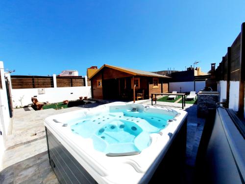 a hot tub sitting on top of a roof at Canary Wild House 2 in Carrizal