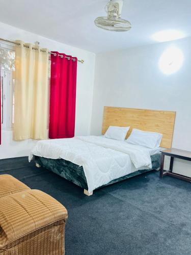 Postel nebo postele na pokoji v ubytování Green Villa Skardu