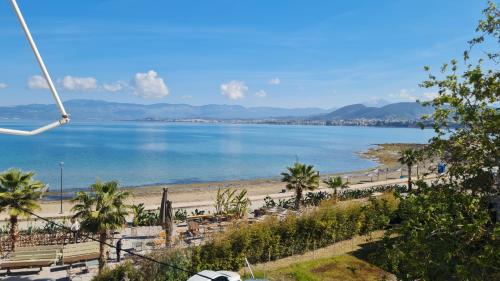 a view of a beach and a body of water at Seaside Apartment - Charlie's House in Chalkida