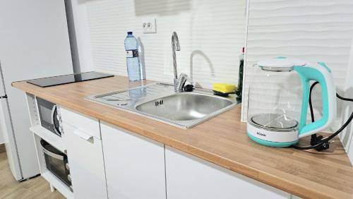 Η κουζίνα ή μικρή κουζίνα στο Apartamento Familiar GoldenTower