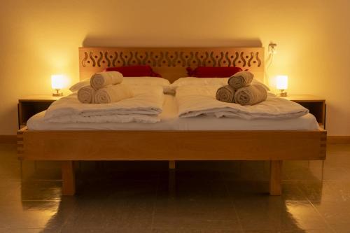 a bedroom with a bed with two pillows on it at Landhaus zum Caphenstain in Gutendorf