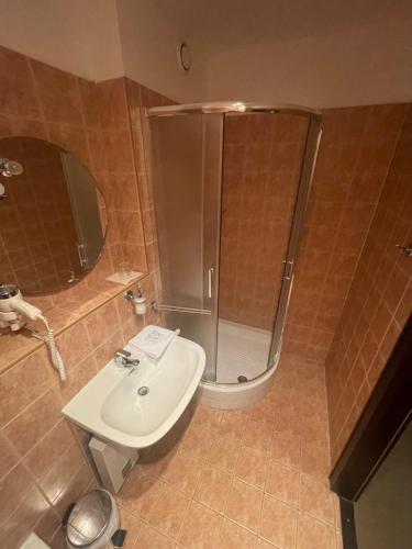 a bathroom with a shower and a sink at Hotel Bravo in Česká Třebová