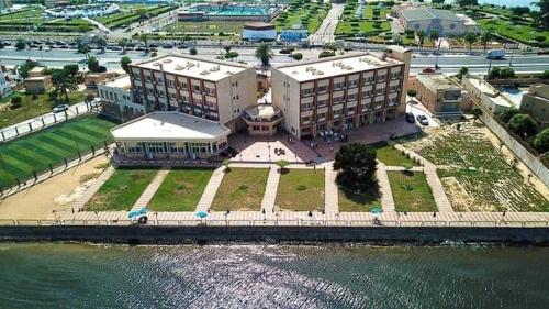 an aerial view of a building next to the water at بيت الشباب الاسماعيلية in Ismailia
