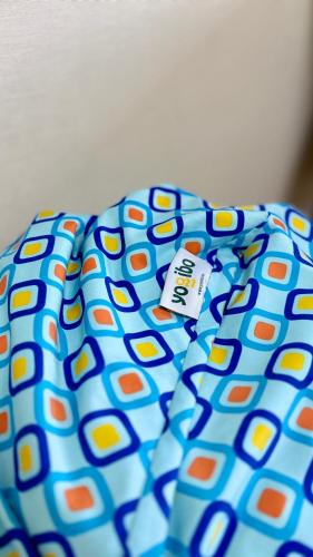 a polka dot pillow with a tag on it at National Stadium-Naadam Center-Tsengeldekh apartment in Ulaanbaatar