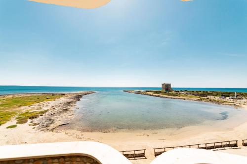 a view of the beach from the balcony of a house at Hotel Alba in Torre Lapillo