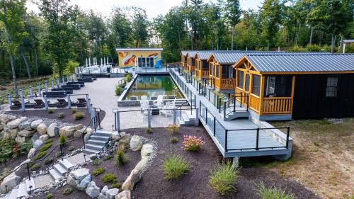 a group of tiny homes with a pool at CARDINAL LIMIT 3 in North Sebago