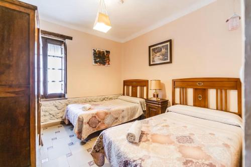 Ένα ή περισσότερα κρεβάτια σε δωμάτιο στο Casa Los Aperos