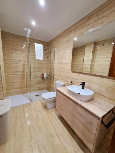 a bathroom with a sink and a toilet and a shower at Apartamento Seymi in Durango