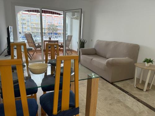 a living room with a couch and a table and chairs at Cozy Sunset in Almerimar