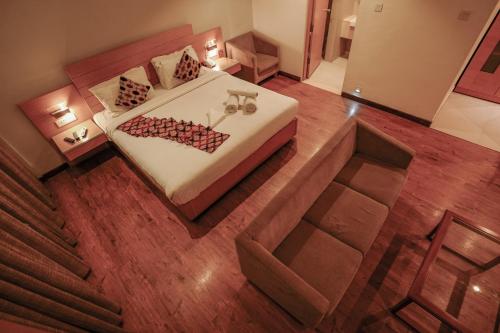 an overhead view of a bed in a room at Hotel Indriya Wayanad in Kalpetta