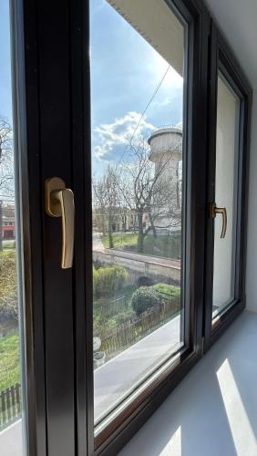 a window with a view of a water tower at VilaVala in Nymburk
