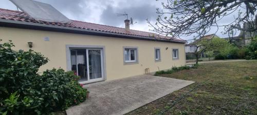 a small yellow house with a driveway at Madureira Country House - Natureza & Tranquilidade in Paradela de Guiães