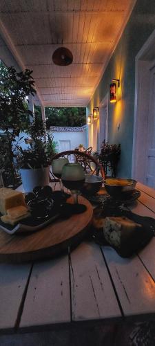 a table with plates of food on top of it at Voda Suite in Bergama