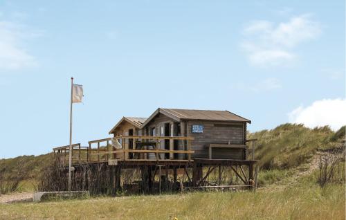 a house sitting on top of a wooden deck at Amazing Apartment In Schiermonnikoog in Schiermonnikoog