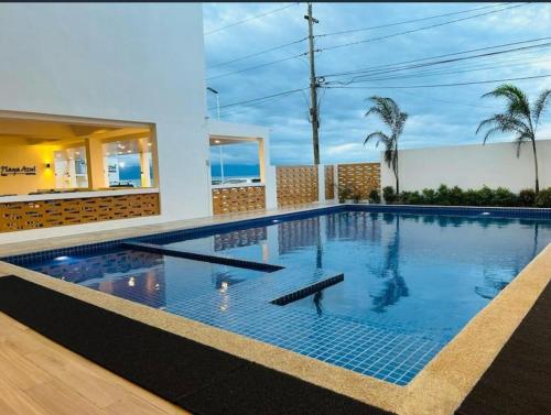 a swimming pool in a house at Playa Azul Baler in Baler