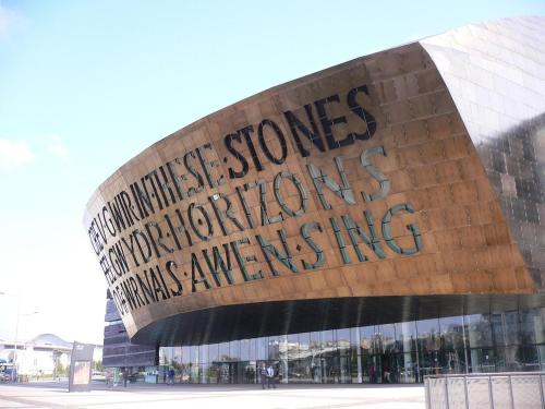 a building with writing on the side of it at Greenways at Coed Cae Farm in Pontnewydd
