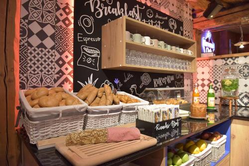 a bakery with baskets of bread and other food at "Das Schlafzimmer" Erlebnis & Boutiquehotel - ehemals Hacienda Mexicana in Spittal an der Drau