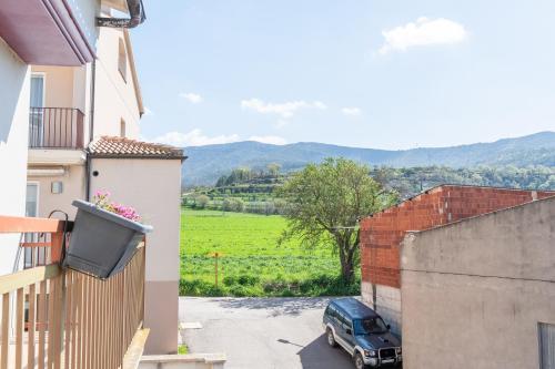 a car parked in a parking lot next to a building at Ca l'Agnès in Oliana