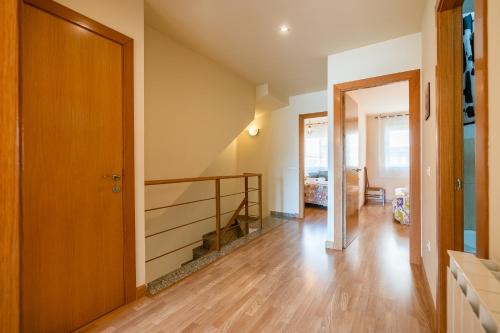 a hallway with a staircase in a house at Ca l'Agnès in Oliana
