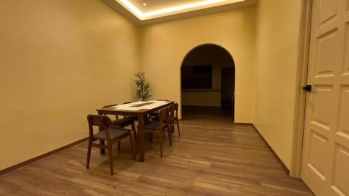 a dining room with a table and chairs at Cosy Nest Homestay with 60 inch 4K android TV in Muar