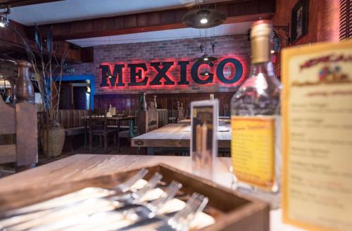 a restaurant with a sign that says mexico at "Das Schlafzimmer" Erlebnis & Boutiquehotel - ehemals Hacienda Mexicana in Spittal an der Drau